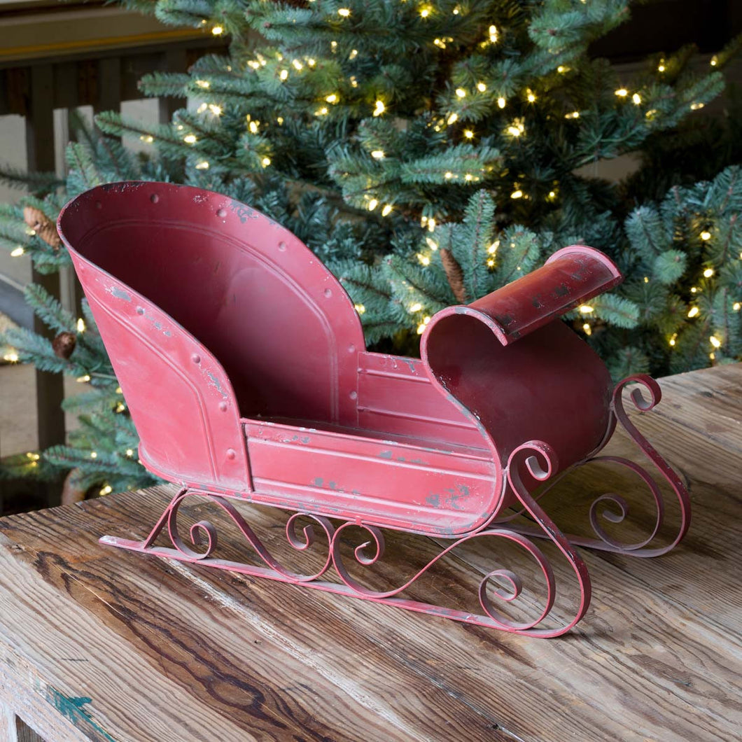 Vintage-Style Red Metal Sleigh with Scroll Detail